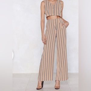 Striped, flare, pants with back zipper and pockets. One piece of a matching set.